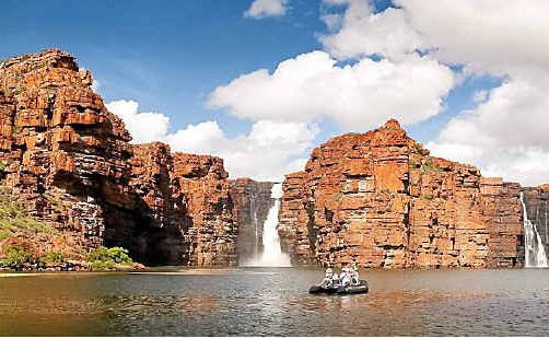 A Zodiac from the Orion expedition cruise ship at King George Falls. A Zodiac from the Orion expedition cruise ship at King George Falls.